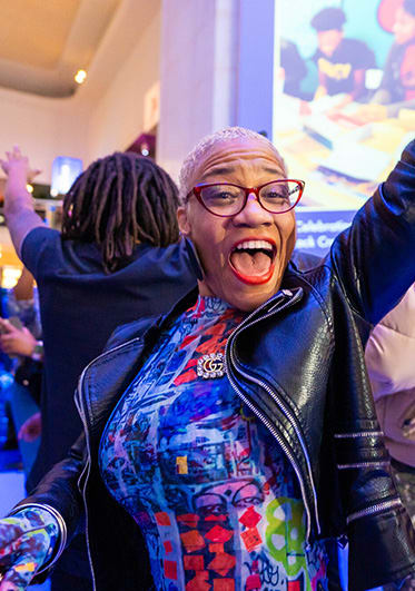 Dancing woman smiles while posing