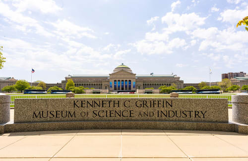 Griffin MSI building with "Kenneth C. Griffin Museum of Science and Industry" sign in foreground